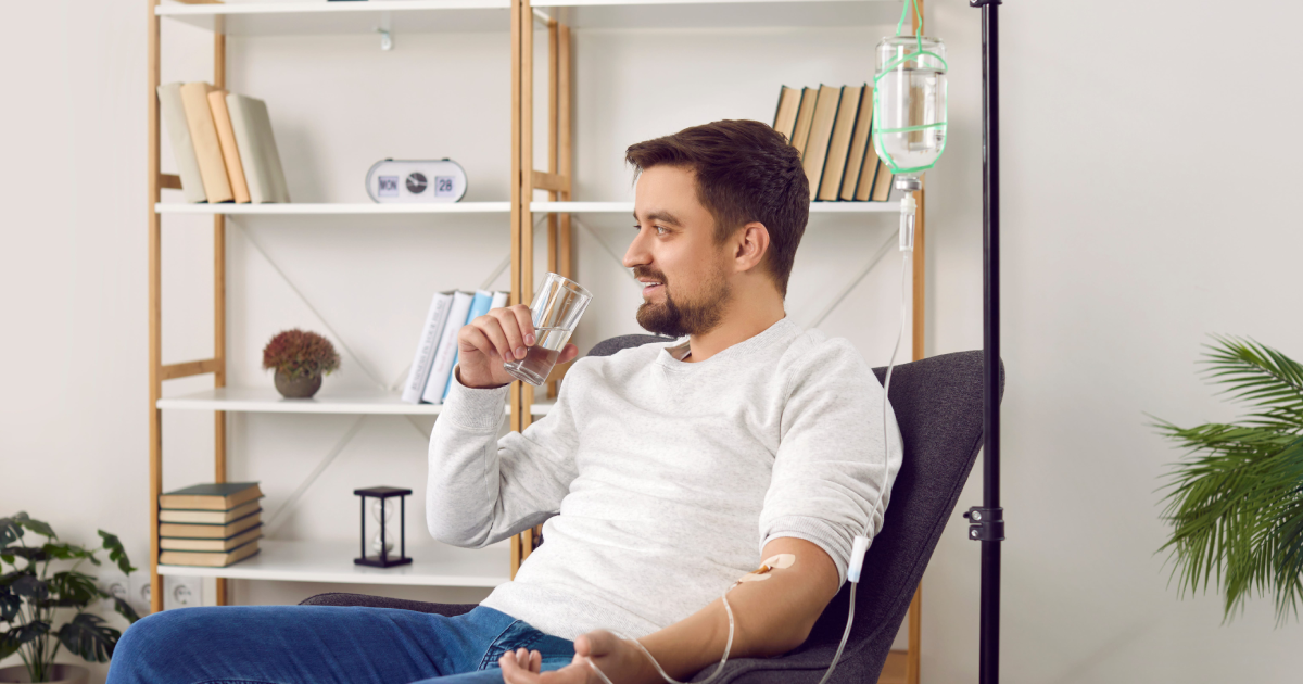 Man smiling while receiving IV therapy in Denver, CO